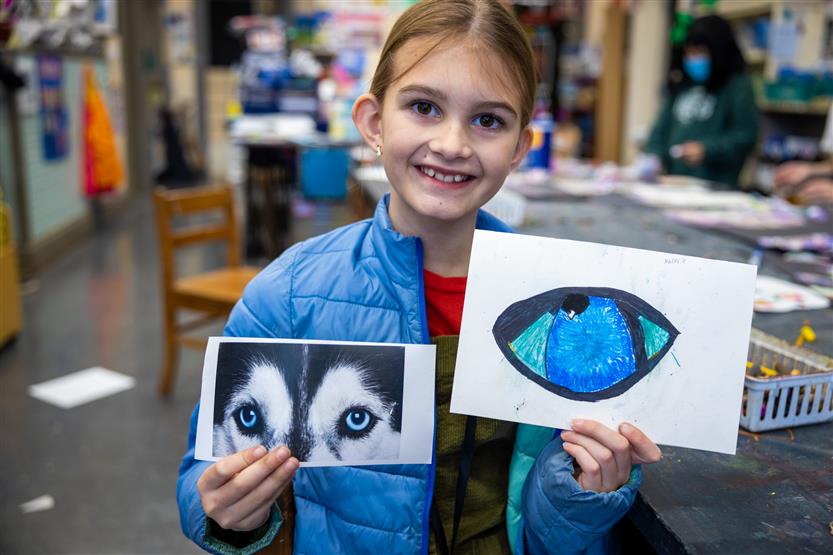 Students in an art class using oil pastels